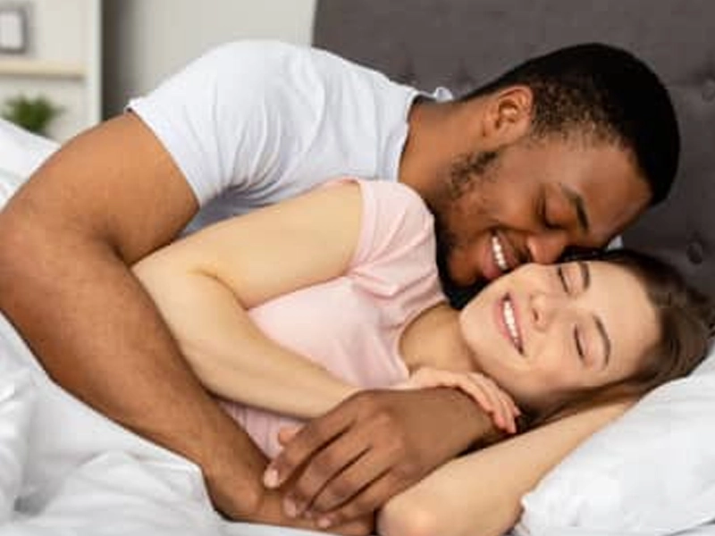 Confident couple experiencing improved intimacy with AlphaSteel support